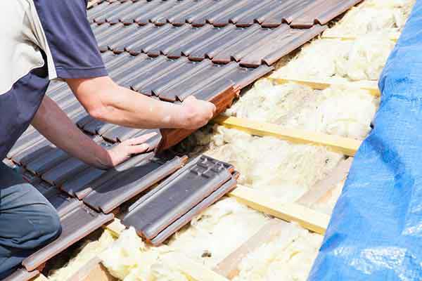 re-roofing winter setting roof tiles