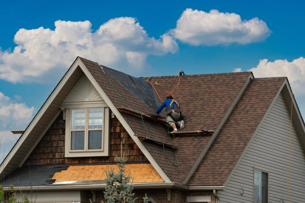 A,worker,moves,along,the,flooring,to,the,next,repair