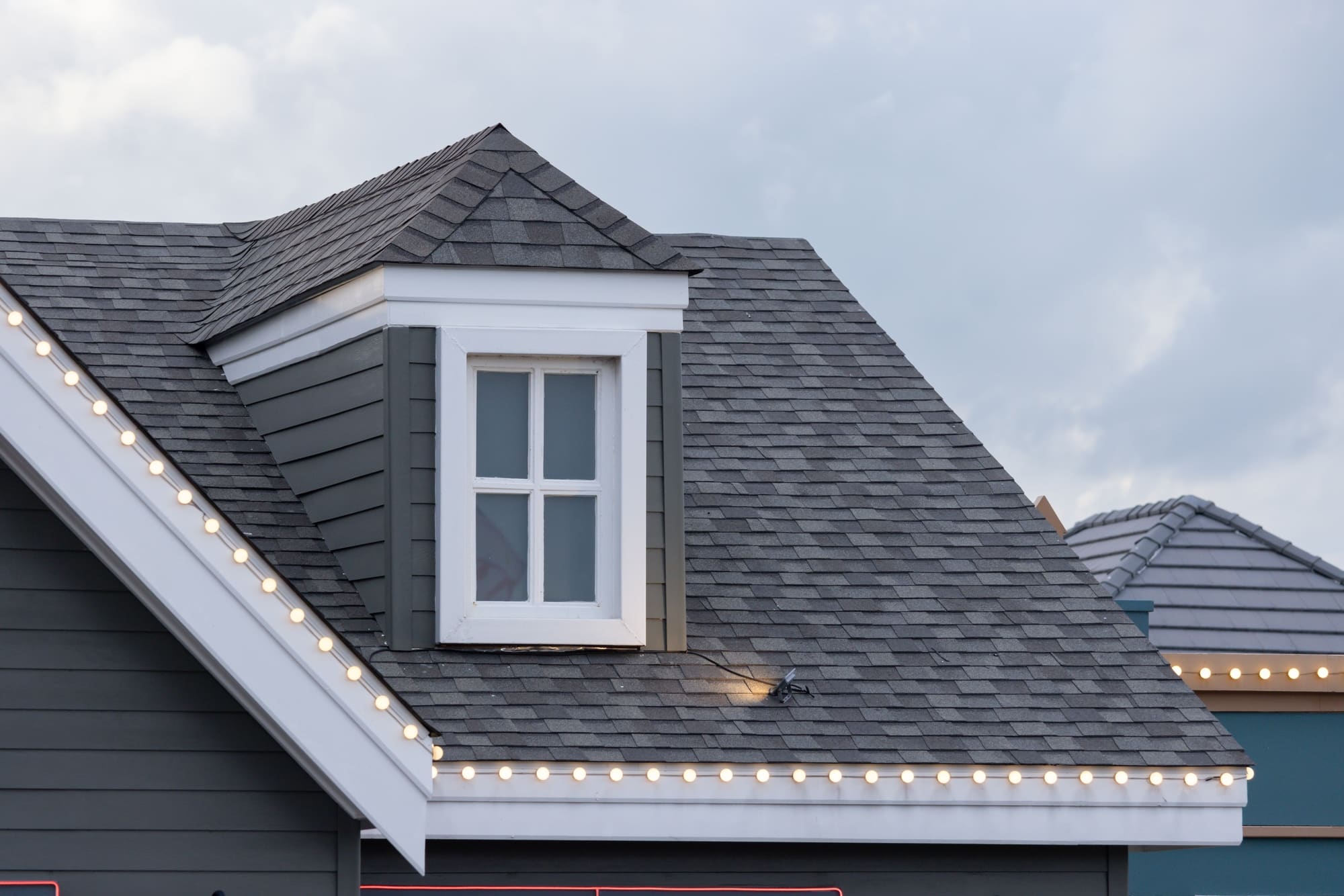 A,house,with,a,slanted,roof,and,a,window,on